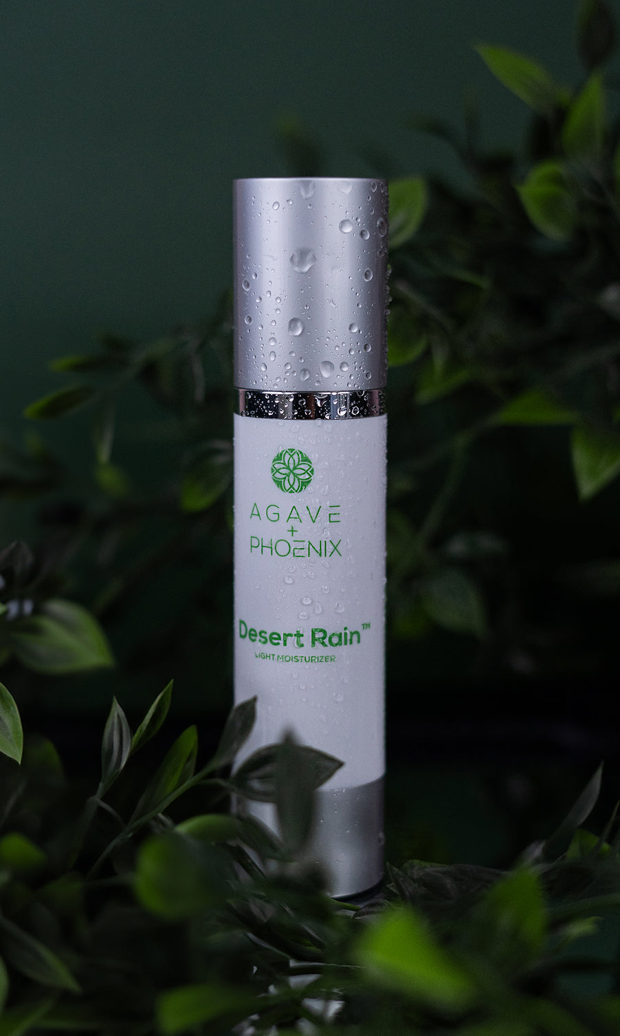 Desert Rain lightweight moisturizer bottle with water droplets — refreshing, hydrating skincare with antioxidant benefits.